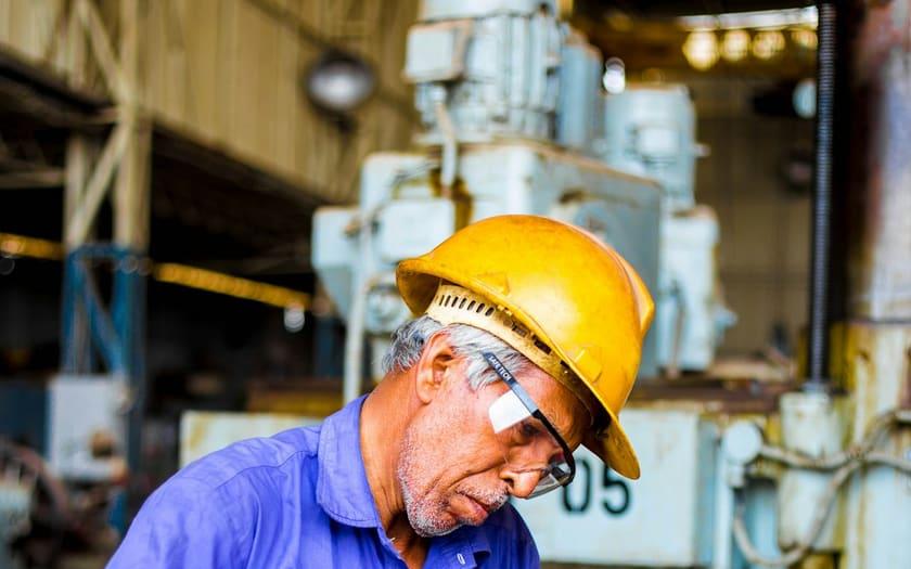 Industrial worker with safety helmet and goggles